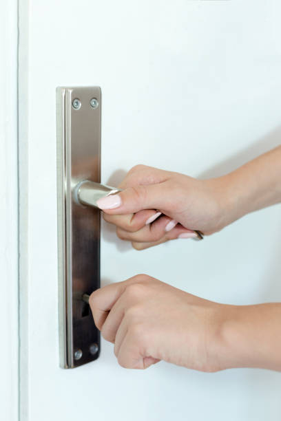 istock Female hand opening a door 1046439528