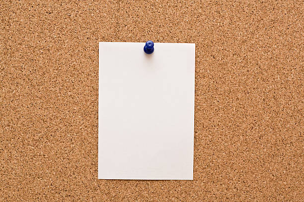 istock White paper pinned to corkboard 104645174