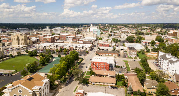 Aerial View Quaint Charming and Humble Over Springfield Missouri The downtown city skyline and buidlings of Sprigfield MO under partly cloudy skies aerial perspective springfield missouri photos stock pictures, royalty-free photos & images
