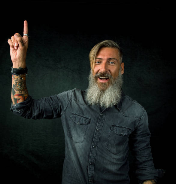 istock Attractive businessman holds his right finger up 1046457638