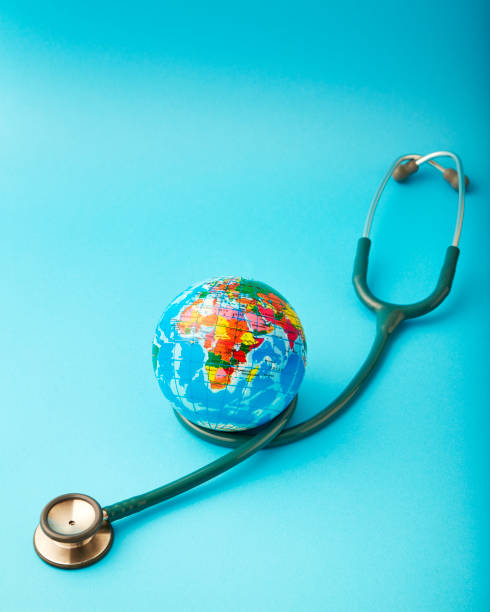 istock World health day ,Stethoscope wrapped around globe on pastel blue background 1046458378