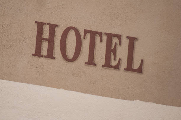 istock hotel signage on stoned wall 1046458628