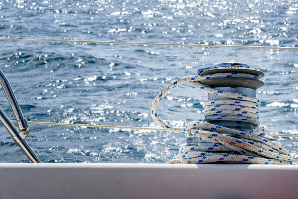 Sail boat winch with rope while sailing in the Atlantic ocean