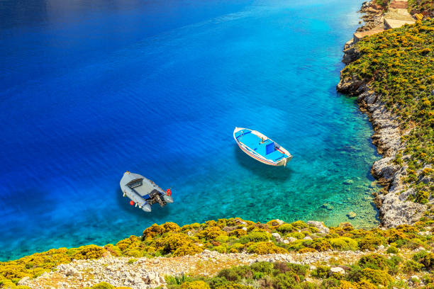 Boats on a shore on one of Greek's islands, Greece stock photo