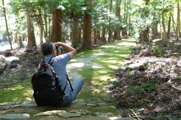 istock Elderly man enjoys photographing 1046478072