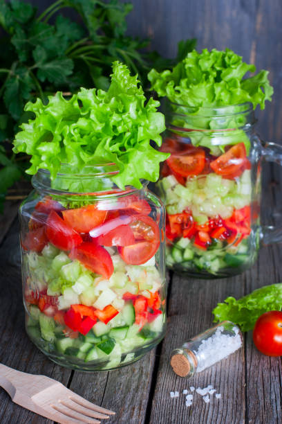 istock Fresh red and green vegetables in glass jar, selective focus 1046480696