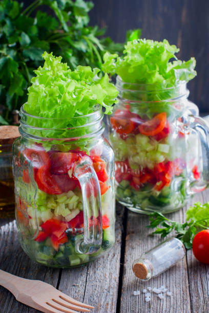 istock Fresh red and green vegetables in glass jar, selective focus 1046480698
