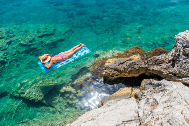 istock Women is sunbathing on the seabed. 1046486176