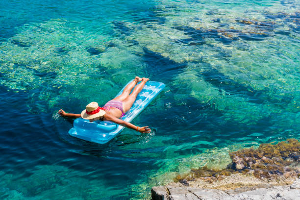 istock Women is sunbathing on the seabed. 1046488626