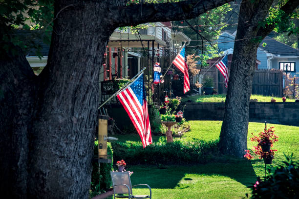 istock 4th of July displaying flags 1046489056