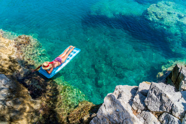 istock Women is sunbathing on the seabed. 1046489188