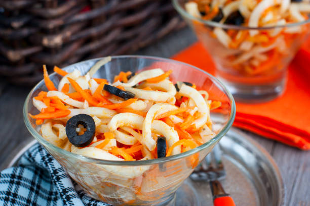 istock Salad with squid and carrots in a bowl, selective focus 1046489340