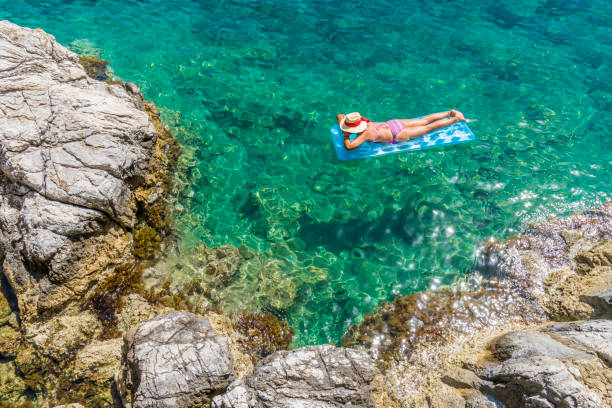 istock Women is sunbathing on the seabed. 1046496532