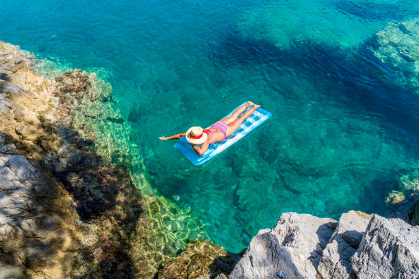 istock Women is sunbathing on the seabed. 1046497176