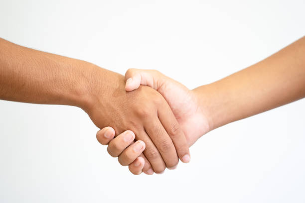 istock Shake-hand or hand holding hand on white background 1046500136