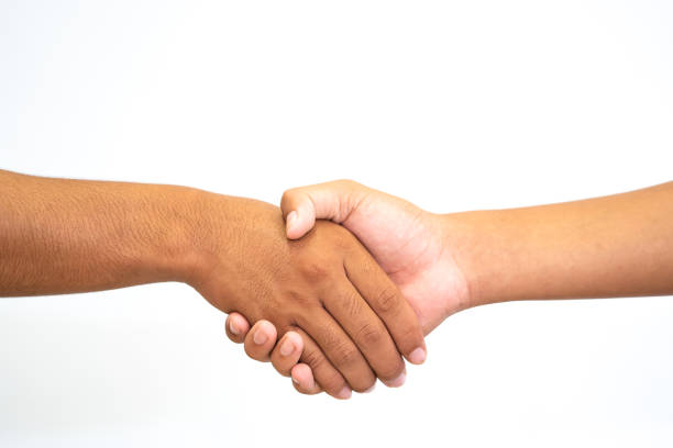Shake-hand or hand holding hand on white background Shake-hand or hand holding hand on white background casual handshake stock pictures, royalty-free photos & images