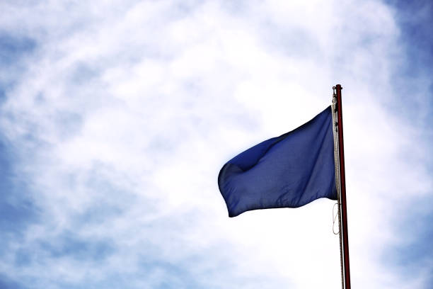 istock High contrast with blue flag and clear blue sky 1046501766