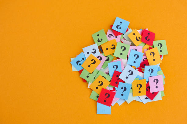 istock Pile of colorful paper notes with question marks on yellow background 1046505348