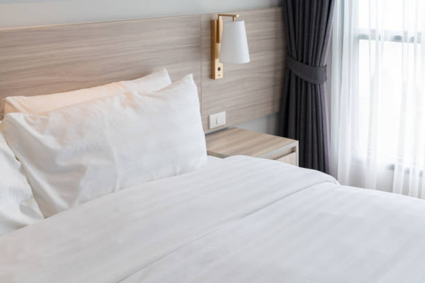 istock modern bedroom with wooden bed 1046508222