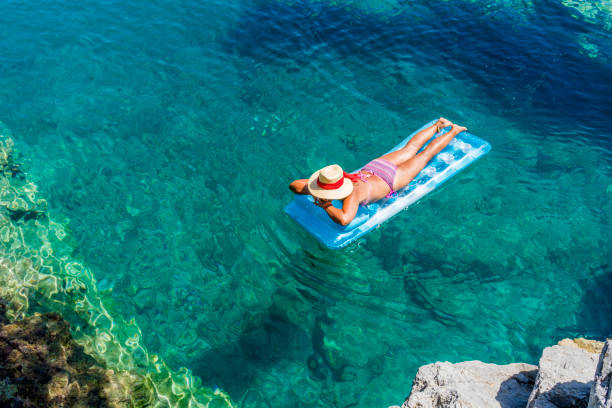 istock Women is sunbathing on the seabed. 1046508510