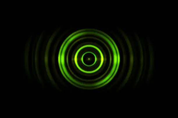 Photo of Sound waves oscillating green light with circle spin abstract background
