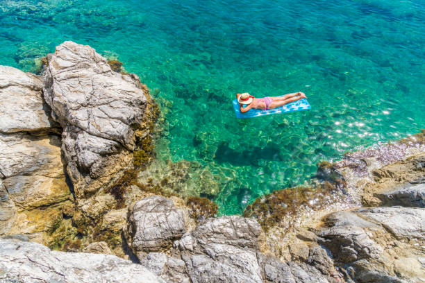 istock Women is sunbathing on the seabed. 1046518372