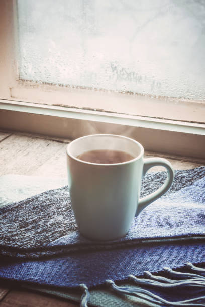 hot tea in the pot near the window. selective focus.