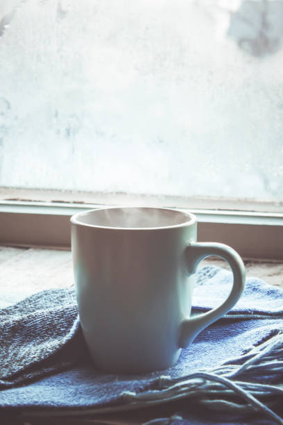 hot tea in the pot near the window. selective focus.