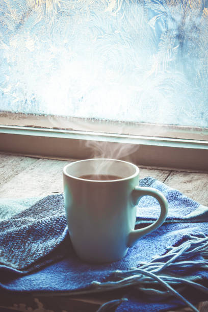 hot tea in the pot near the window. selective focus.
