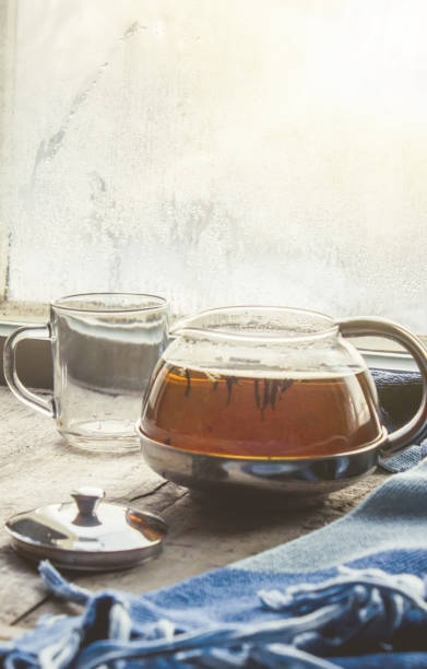 hot tea in the pot near the window. selective focus.