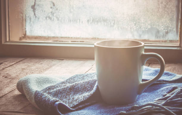 hot tea in the pot near the window. selective focus.