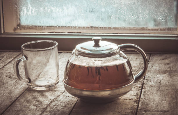 hot tea in the pot near the window. selective focus.