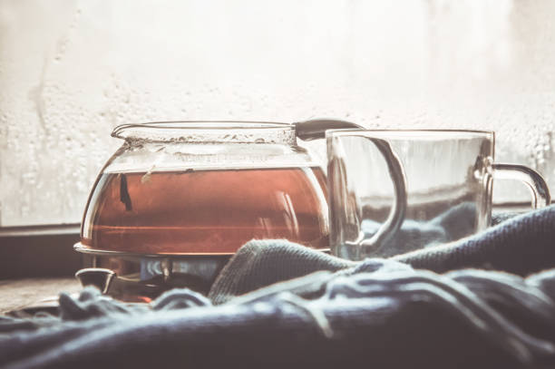 hot tea in the pot near the window. selective focus.