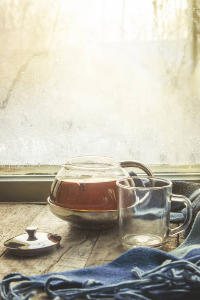 hot tea in the pot near the window. selective focus.