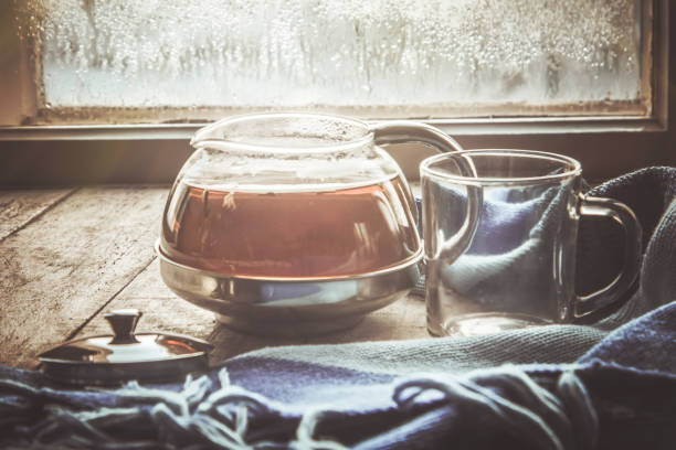 hot tea in the pot near the window. selective focus.