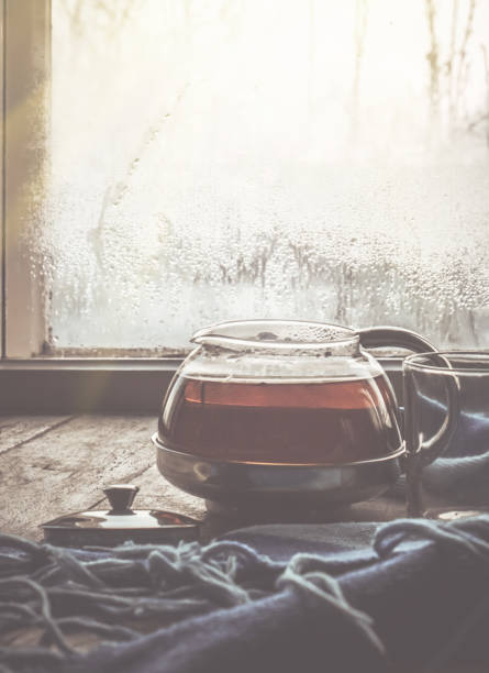 hot tea in the pot near the window. selective focus.