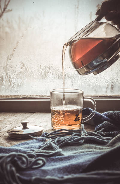 hot tea in the pot near the window. selective focus.