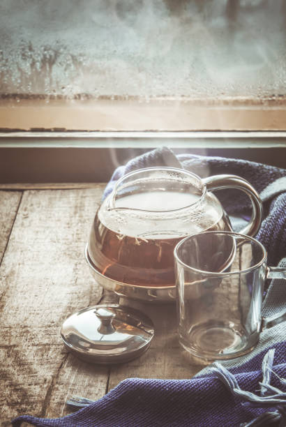 hot tea in the pot near the window. selective focus.