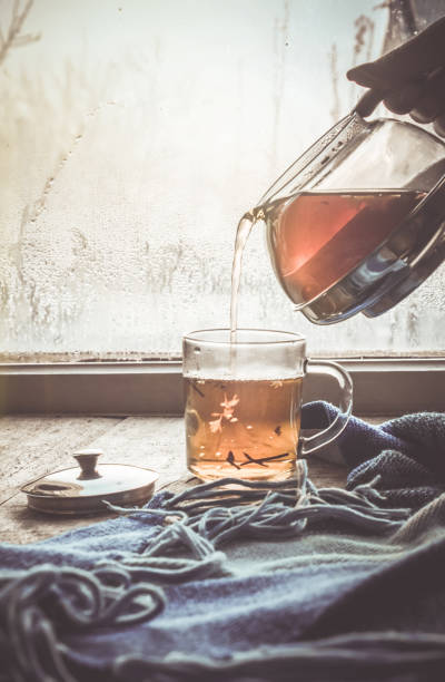 hot tea in the pot near the window. selective focus.