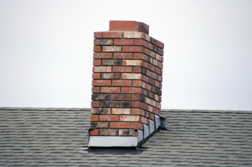 pipe on roof of wooden beam cottage villa house on sky background