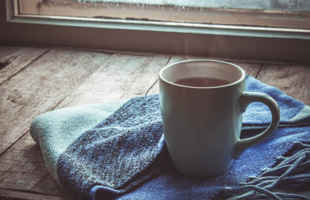 hot tea in the pot near the window. selective focus.