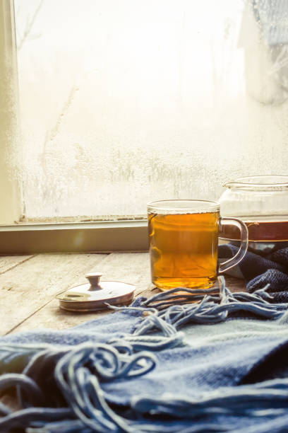 hot tea in the pot near the window. selective focus.
