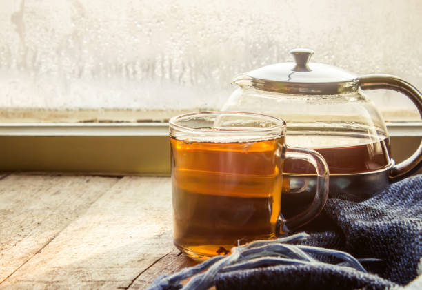 hot tea in the pot near the window. selective focus.