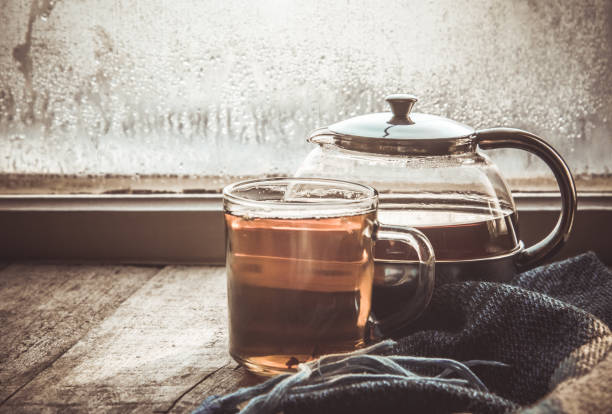 hot tea in the pot near the window. selective focus.