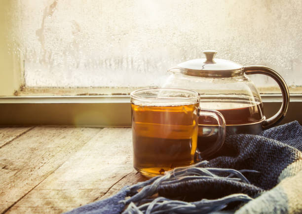hot tea in the pot near the window. selective focus.