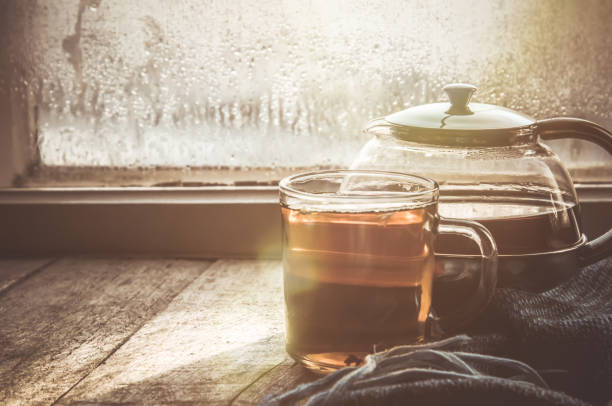 hot tea in the pot near the window. selective focus.