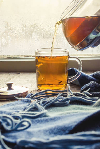 hot tea in the pot near the window. selective focus.
