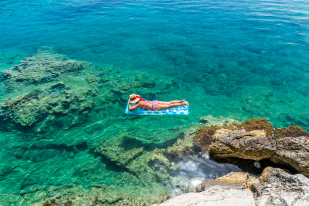 istock Women is sunbathing on the seabed. 1046522236
