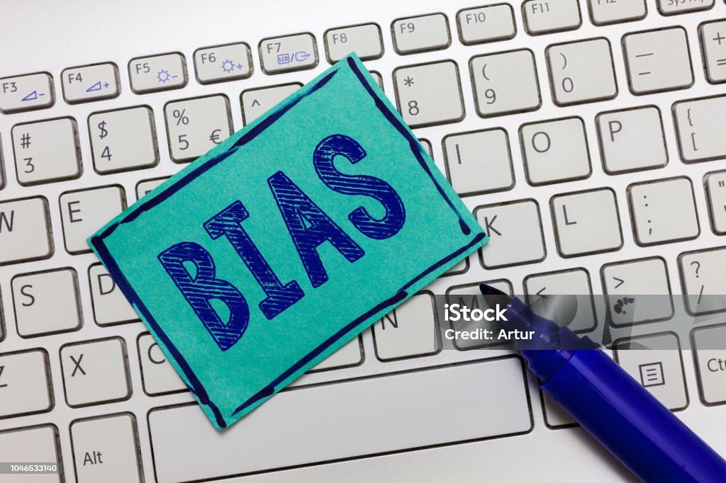 Handwriting text Bias. Concept meaning Prejudice in favor of and against one thing Considered to be Unfair Handwriting text Bias. Concept meaning Prejudice in favor of and against one thing Considered to be Unfair. Bias Stock Photo