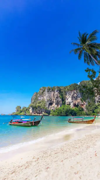 Photo of Amzing landscape with traditional longtail boats, tropical sea T